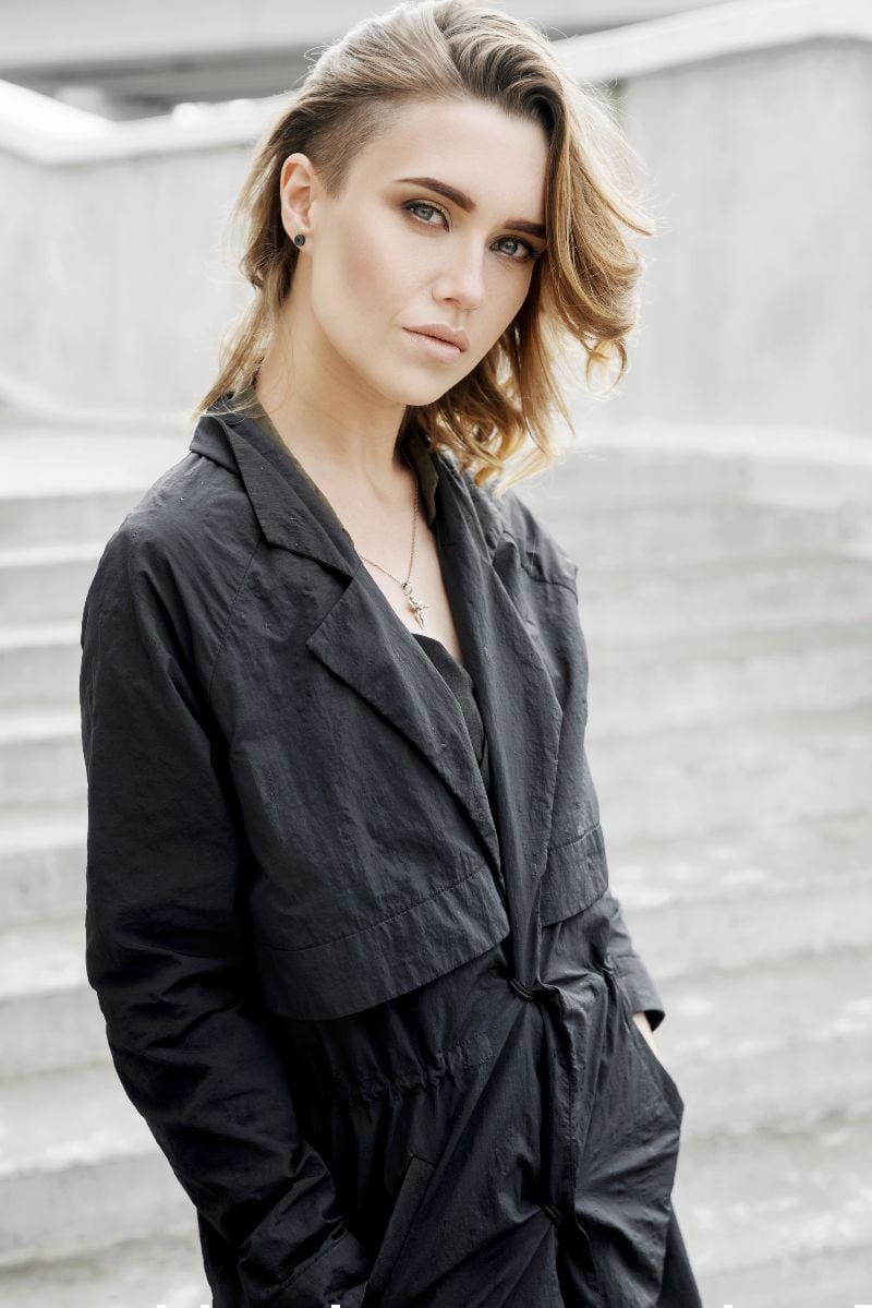 fashion young girl walks down street | layered undercut