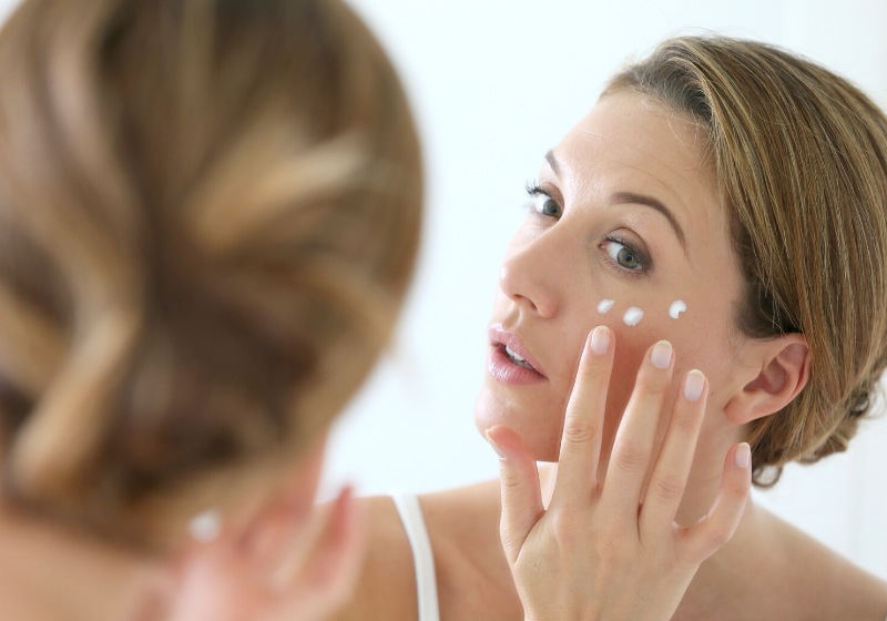 middleaged woman applying antiaging cream | prevent wrinkles