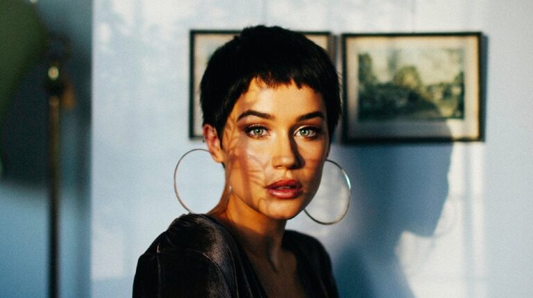 serious woman with makeup in stylish earring | Stylish Pixie Bob Haircut Ideas To Rock This Season | Featured