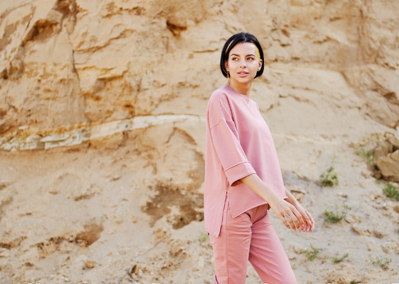 trendy model in sandals near rough mountain | classic undercut