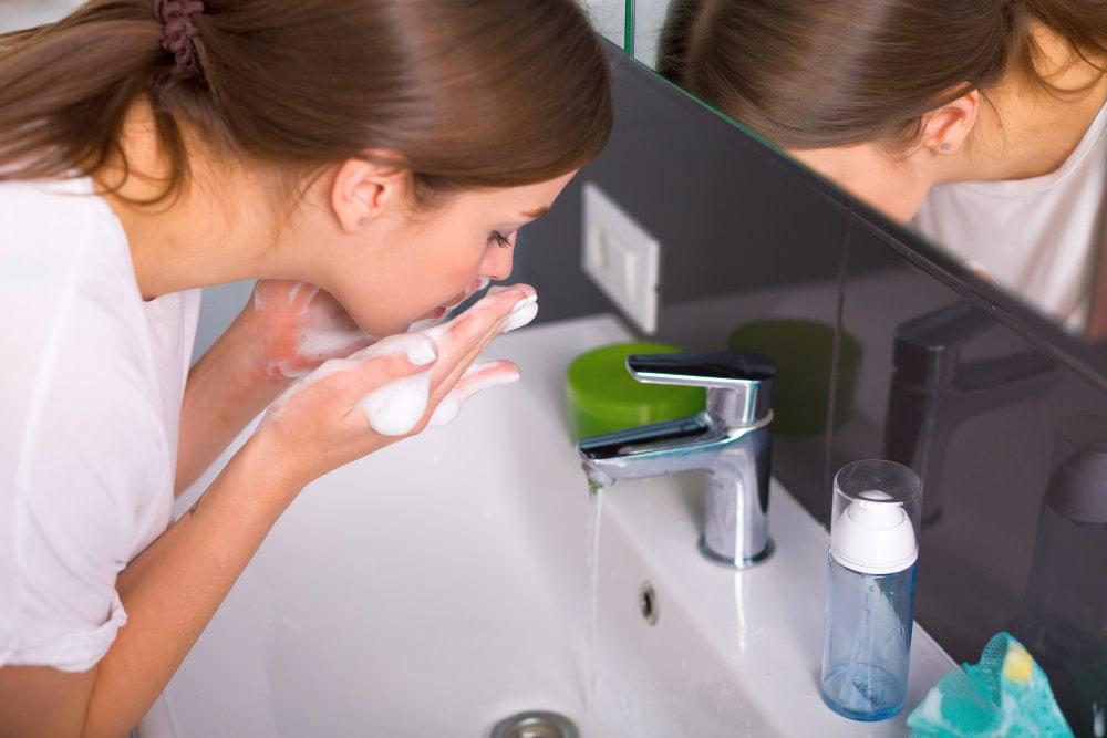 Woman washing up her face with foam cleanser in the morning | 2020 Skincare Trends: Biggest Beauty Innovations To Watch Out For | new skin ingredients