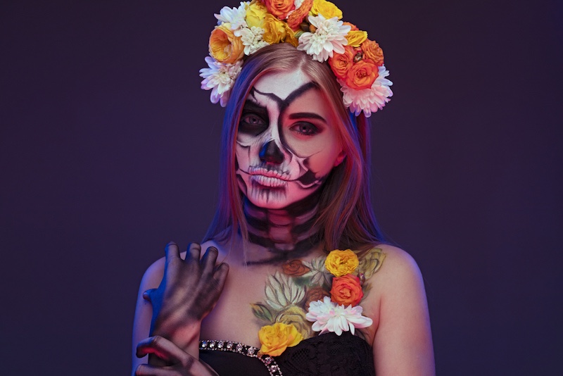 young-woman-skeleton-makeup-wearing-floral | unique halloween makeup